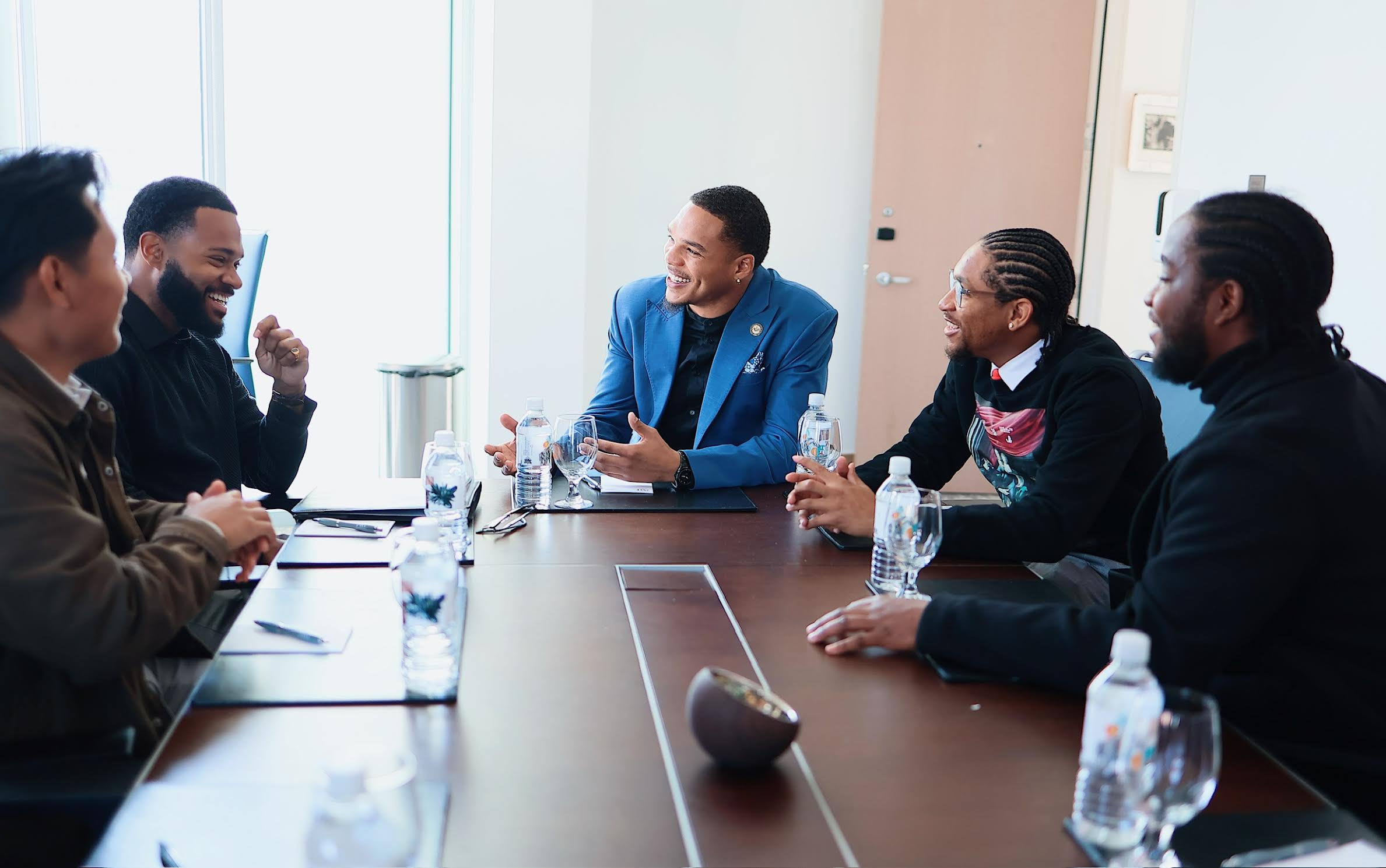 Koi Inc. team collaborating around a conference table
